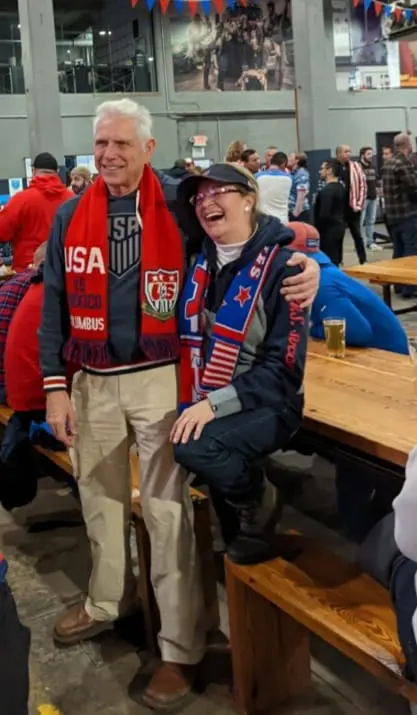 Two men are posing for a picture at an event.