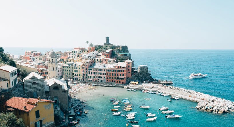 A view of the ocean and boats in the water.