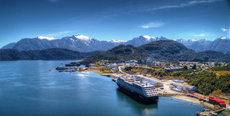 A cruise ship is docked in the water.