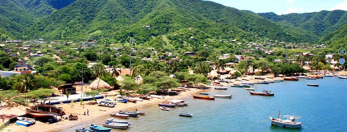 A beach with boats and people in it