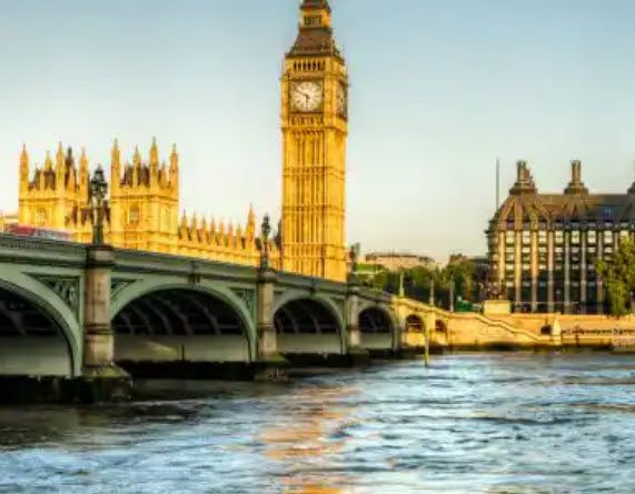 A large clock tower towering over the city of london.