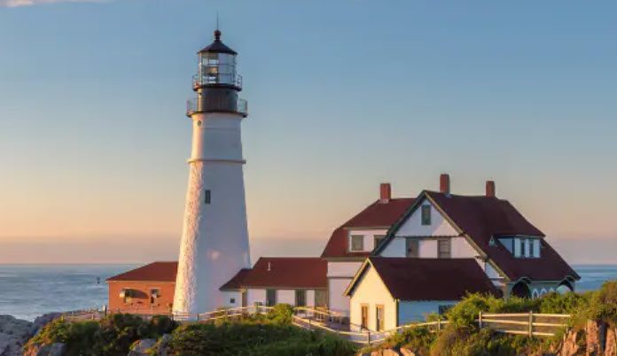 A lighthouse with many buildings in the background