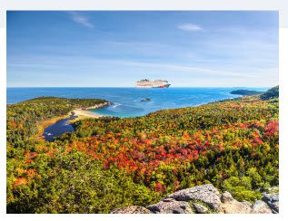 Cruise ship sailing by a fall forest.