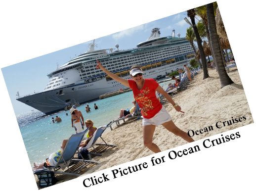 Woman on beach with cruise ship in background.